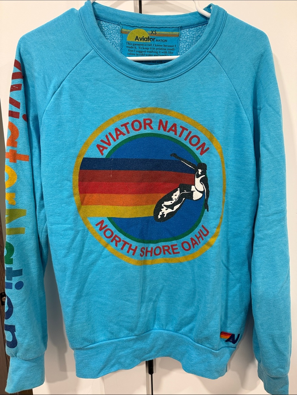 Aviator Nation Men’s Turquoise Crewneck with Multicolor Surf Graphic